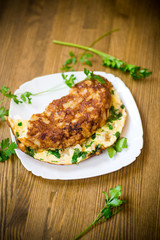 fried omelet with cauliflower and greens in a plate