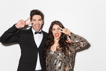 Cheerful young smartly dressed celebrating New Year