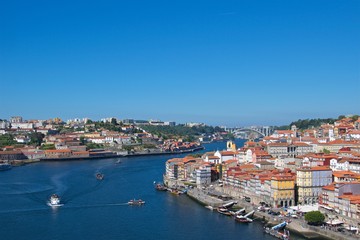 Naklejka na ściany i meble View of old Porto with bridge over Douro River in Portugal