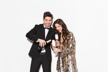 Cheerful young smartly dressed celebrating