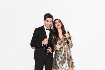 Cheerful young smartly dressed celebrating