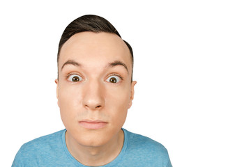 Portrait of young surpriced guy isolated on a white background.