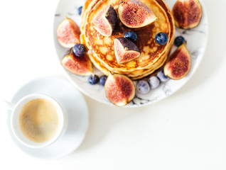 Breakfast pancakes with figs and coffee