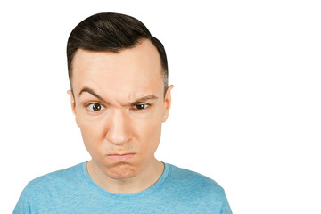 Obraz premium Portrait of young gloomy serious, severe, grave, earnest, guy isolated on a white background.