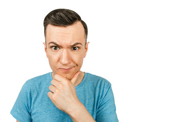 Portrait of young thinking guy with hand at face isolated on a white background.