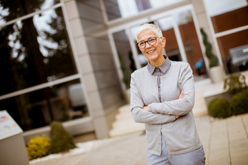 Outdoor portrait of happy senior businesswoman