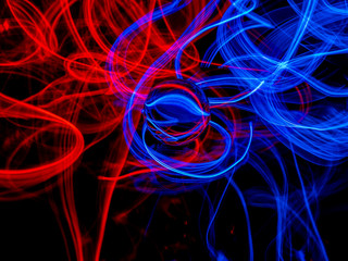 Using the light painting technique with a lens balls and eectroluminescent wire against a black background II.