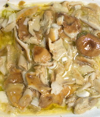 marinated mushrooms in oil on a plate