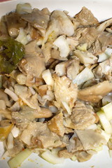 salted mushrooms in sunflower oil close up