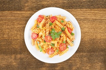 Delicious pasta on white plate on  background