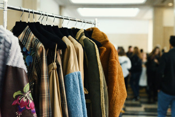 Colorful clothes on hangers