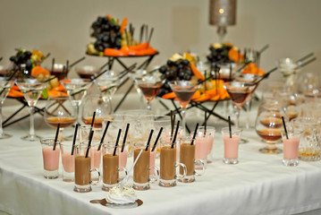 Glass glasses with colored drinks on the table. alcoholic drinks at the buffet
