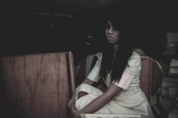 Portrait of asian woman make up ghost face with blood,Horror scene,Scary background,Halloween...