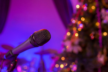 Microphone on the background of the New Year tree
