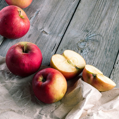 Cut red apples on wooden boards