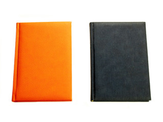 Orange and blue notepads isolated.
