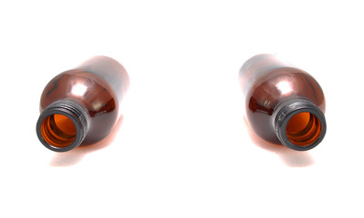 Brown empty bottle on white background close up