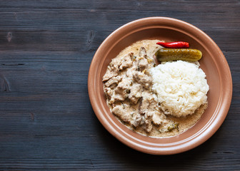 portion of Beef Stroganoff on dark table