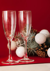 Wineglasses on red christmas background.
