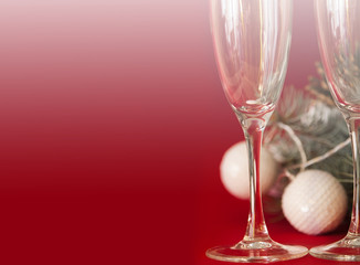 Wineglasses on red christmas background.
