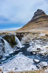 Kirkjufell watefall and mountain, Iceland, in winter