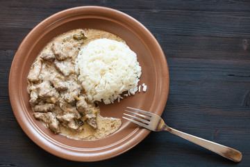 prepared for eating a portion of Beef Stroganoff