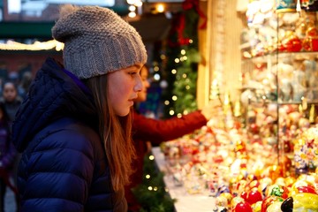 A teenage girl shopping at the Toronto Christmas Market