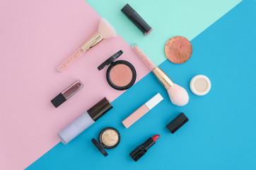 Flat lay Cosmetics for makeup, brush, highlighter, concealer, makeup, lipstick, primer, blush on...