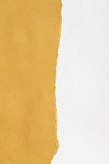 torn brown paper on white paper with copyspace