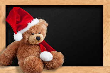 Teddy bear in santa hat