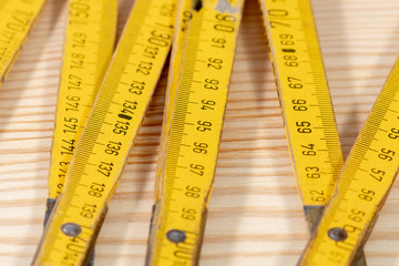 Close up of yellow used yardstick