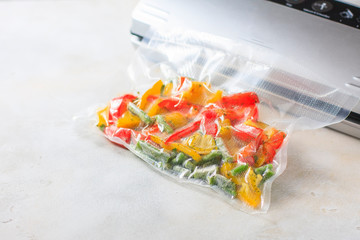 Vegetables in sealed vacuum packing bags. Su-video cooking.