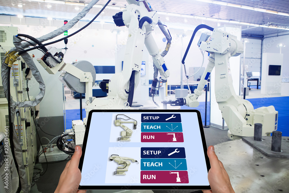Aufkleber Engineer with digital tablet. Programming robots with robotic arm. Smart factory 