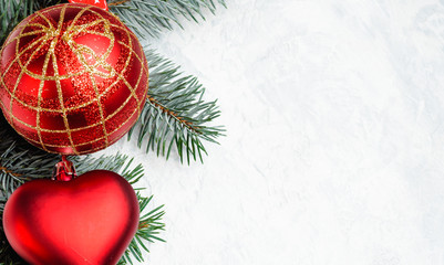 Christmas decorations and branches of a New Year tree on abstract background. Flat lay, top view, copy space