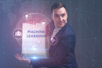 The concept of business, technology, the Internet and the network. A young entrepreneur working on a virtual screen of the future and sees the inscription: Machine learning