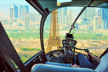 Helicopter cockpit flying on Paris Tour Eiffel tower skyline. Scenic flight over Paris skyline.