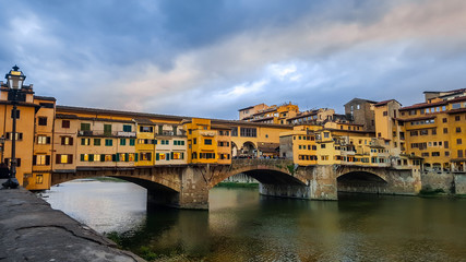 The Ponte Vecchio is a medieval stone closed-spandrel segmental arch bridge over the Arno River, in Florence, Italy