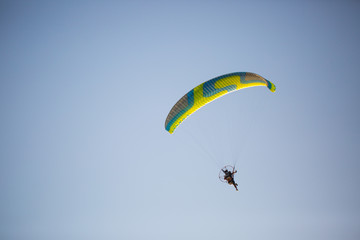 Hang-glider enjoying his flight in the sky, extreme sports