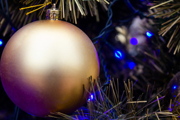 New-year decorative ball on a background a christmas tree