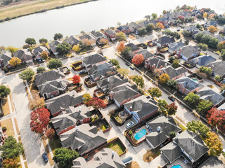 Aerial view typical lakeside residential neighborhood in suburban Dallas, Texas, USA. Row of...