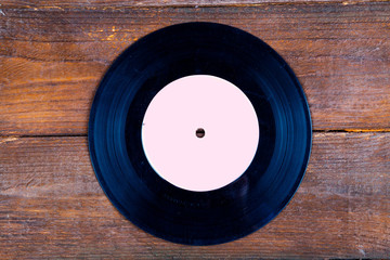 Vinyl record on wooden background