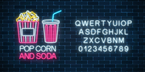 Neon glowing sign of pop corn and soda with alphabet. Cinema fastfood light billboard symbol.