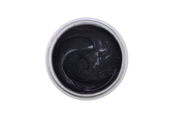 Natural face mask. Birch charcoal and thermal mud for skin care. Top view. Isolated on white background