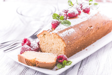 Cake with raspberries and mint leaves