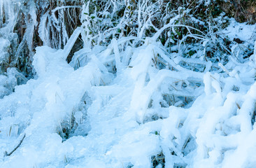 Ice crystals formed by river water. Icy background.