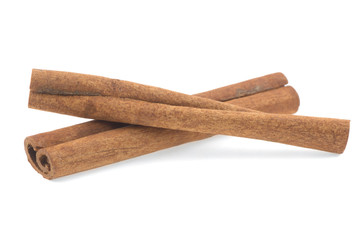 two cinnamon sticks isolated on white background