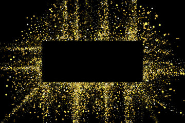 Gold glitter party confetti texture banner frame with place for text on a black background. Golden explosion of confetti. Colorful grainy dust abstract texture. Christmas background design element.