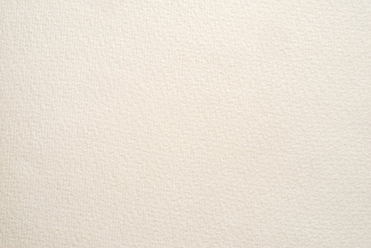 textured paper for watercolor painting. beige factured background, suitable as a backdrop for business presentation.