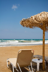 Beach chair by the sea in sunny day. Romantic mood. Travel paradise concept