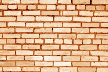 Obraz premium Old grungy brick wall surface in orange tone.